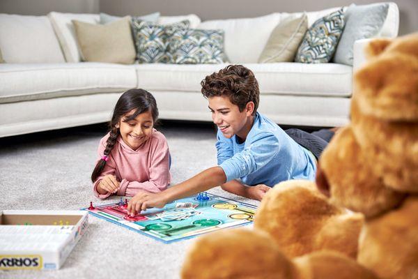 kids playing a game on the carpet