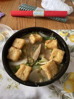 Vegetable broth with tofu, cabbage, udon noodles, garlic, extra sesame paste, bok choy, and green onions.