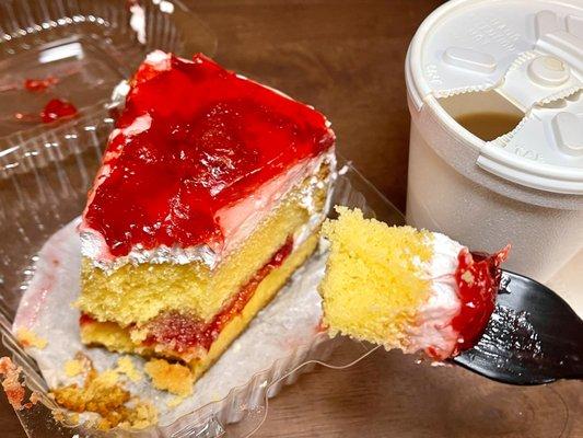 Slice of strawberry cake and coffee