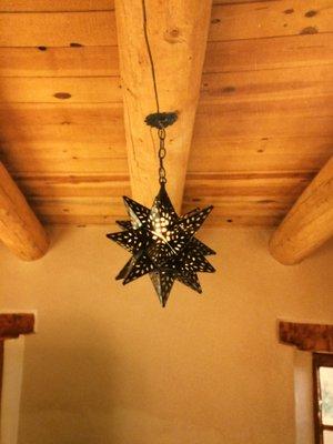 Decorative ceiling mounted fixture installed by Enchanted Electric.