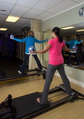 Standing Splits on Pilates Reformer