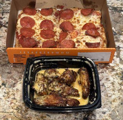 Pepperoni  pizza and chicken wings