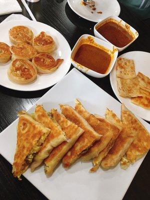 Coin prata (get this!!), cheese prata, and mutton murtabak. Sides of chicken curry and vegetable curry.