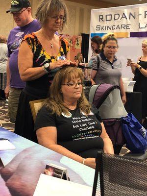 A reiki demo at a women's expo.