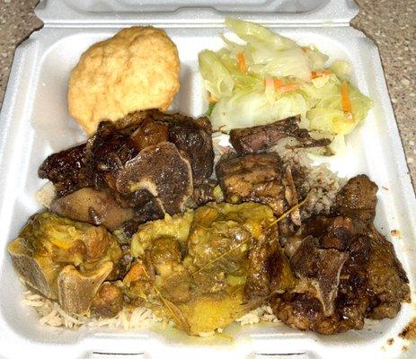 Oxtails with rice, cabbage, and a fried dumpling.