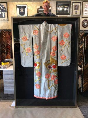 Full size kimono framed in a shadow box.