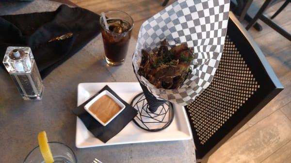 Steak frite, wedge fries with cheslese and steak. Very good.