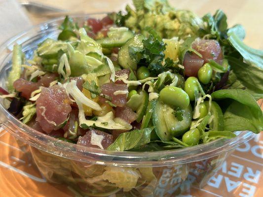 Poke Bowl, Salad Base, Tuna, cucumber, edamame, Serrano, cilantro, kale, avocado, and a mix of ponzu/Hawaiian sauces.