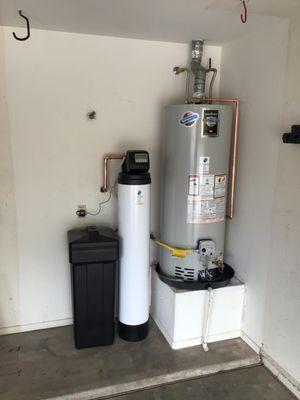 Water Softener installation. Removing the hardness from the water will help your plumbing and water-using appliances last even longer!