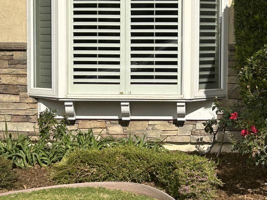 Rock installation under front window.