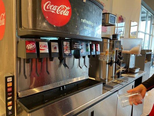 Broken drink machine and empty teas.