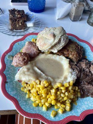 Rolls and butter, Ham Balls, Chicken, Beef, Corn, Mashed Potatoes, Gravy and Homemade Cake.