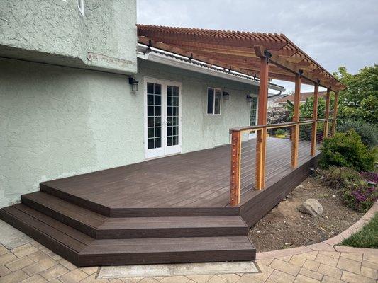 Composite deck with wire rails and wooden pergola