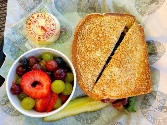 Sassy Scotty Chicken Salad BLT on Toasted White Bread, Fresh Fruit Cup, Quartered Pickle Spear, Small Round Buttercream Cookie