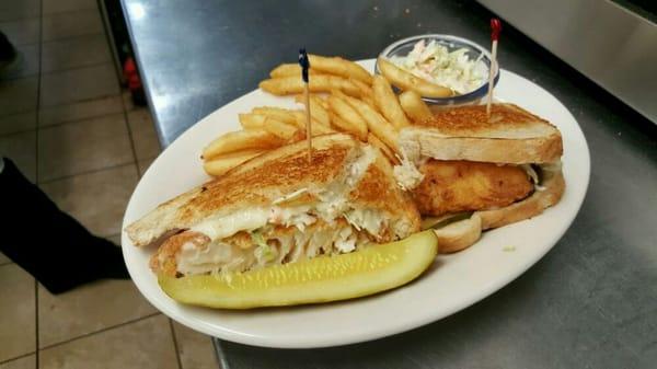 Haddock Reuben with fries and homemade coleslaw