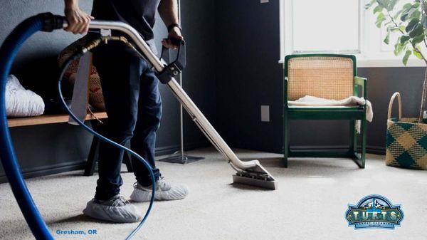 Meet our team member at Tufts Carpet Cleaning in Gresham, OR! They're expertly deep cleaning this light colored carpet, leaving it fresh and