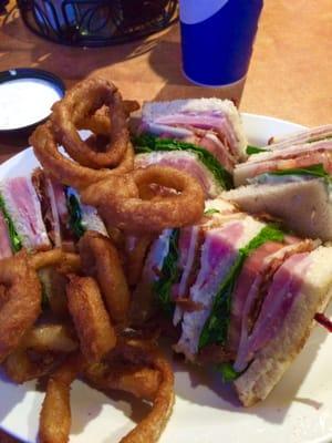 Club sandwich with homemade onion rings