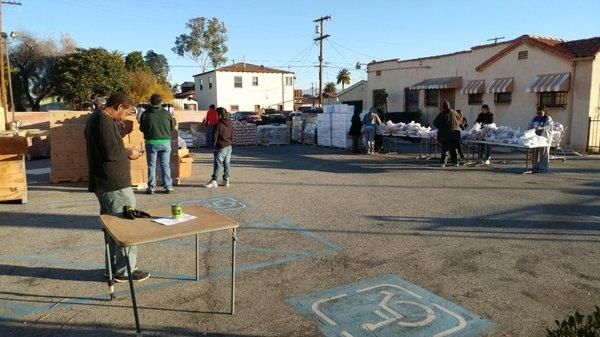 Passing food and item's out to the ones in need.