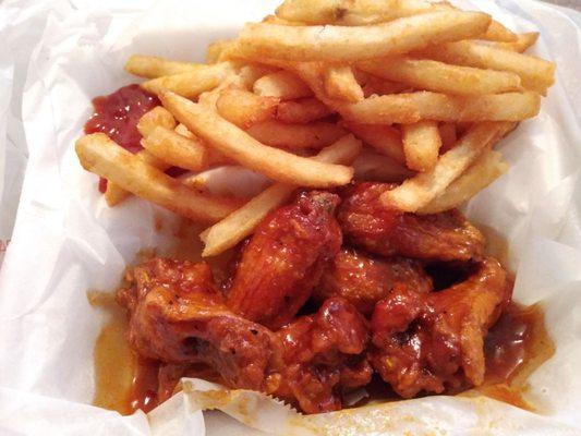 Spicy teriyaki wings (extra crispy) and fries.