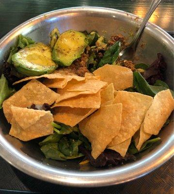 Texas taco salad with some extra grilled avocado. Dressing on the side! The jalapeño ranch is spicy! Served in a bowl trough lol