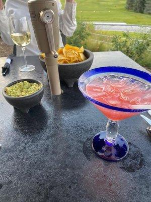 Chips and guacamole, raspberry grapefruit margarita, and chardonnay.