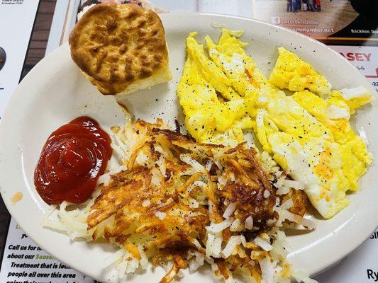 Scrambled eggs, hash browns, biscuit