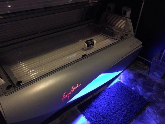 Tanning bed with cool blue lighting