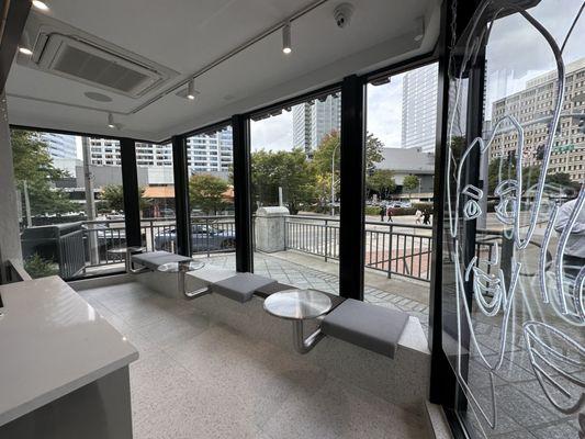 Cute stainless tables for bench seating