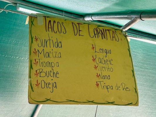 Menu showing different parts of a pig (stomach, ear, tongue, cheek, skin, etc.), plus beef tripe.