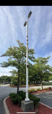 Before Parking lot light poles restored for development company