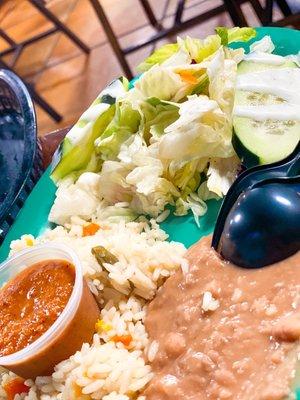 Complimentary rice, beans and salad with each entree