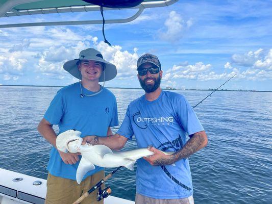 Captain Tom teaching my son fishing safety.