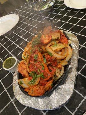 Chicken Tikka Masala. - sizzling onions on a bed of marinated chicken.  I wish you could smell how yummy this dish is.