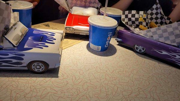 Kids meals come in cool car containers.