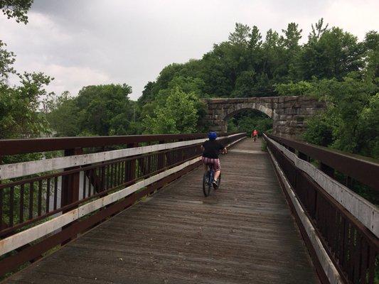 Little path ending in the bridge over the river.  (Not are what happened to it after this point, but it's blocked off and overgrown)