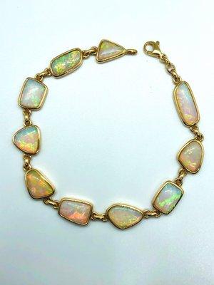 Australian opal bracelet set in 14 karat yellow gold