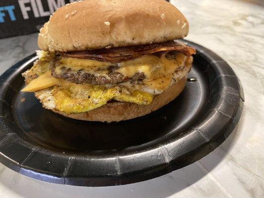 The Delicious Creation 
Breakfast sausage patty served with fried egg, melted  cheese, ham, on a toasted bun