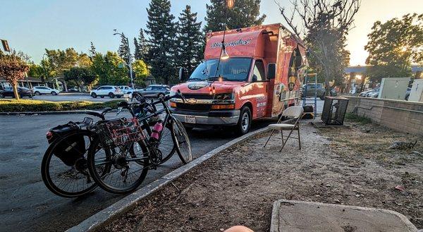 the truck, with lighting and chairs nearby