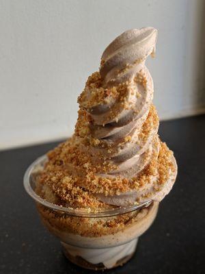 Chocolate donut soft serve over Vietnamese coffee tres leches cake, sprinkled with donut crumble