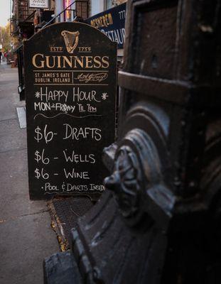 Happy Hour Sign $6 Drafts, Wine, Wells Mon-Fri 12p-7p