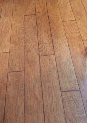 Large plank laminate flooring in a color called Hickory Wheat