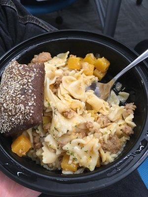 Sausage and maybe butternut squash (?) with bowtie pasta and bread. Was yummy!