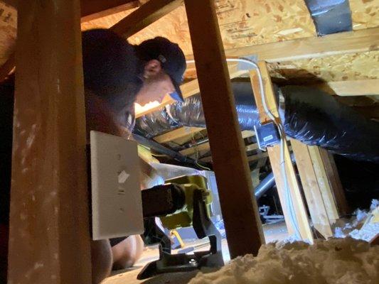 Verifying ducting connections during an attic inspection