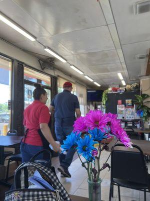 Fresh flowers on all the tables. Suck a quaint, nice touch.