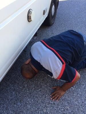 Anselmo inspecting and taking care of my vehicle