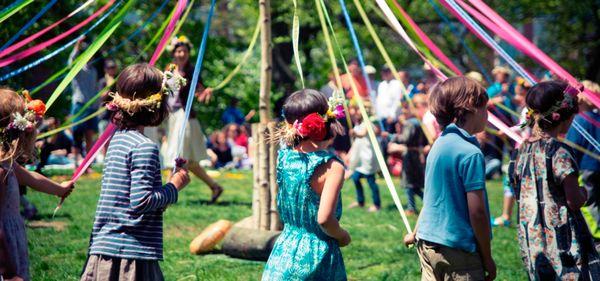 Dancing around the maypole at our annual May Fair celebration.