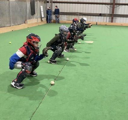 6 week catching camp this past winter.  Baseball catchers working on blocking.