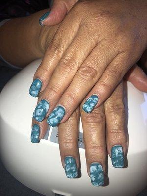 Beautiful blue calor with Nail art.