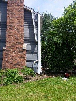 Painted fan housing to match siding.  White gutter to match trim.