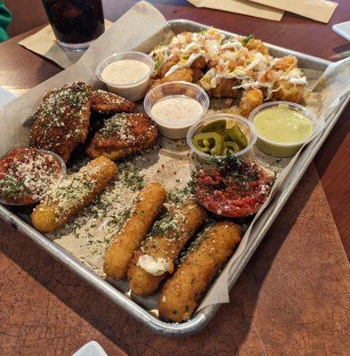 Appetizer trio with mozzarella sticks, fried ravioli, and loaded tots